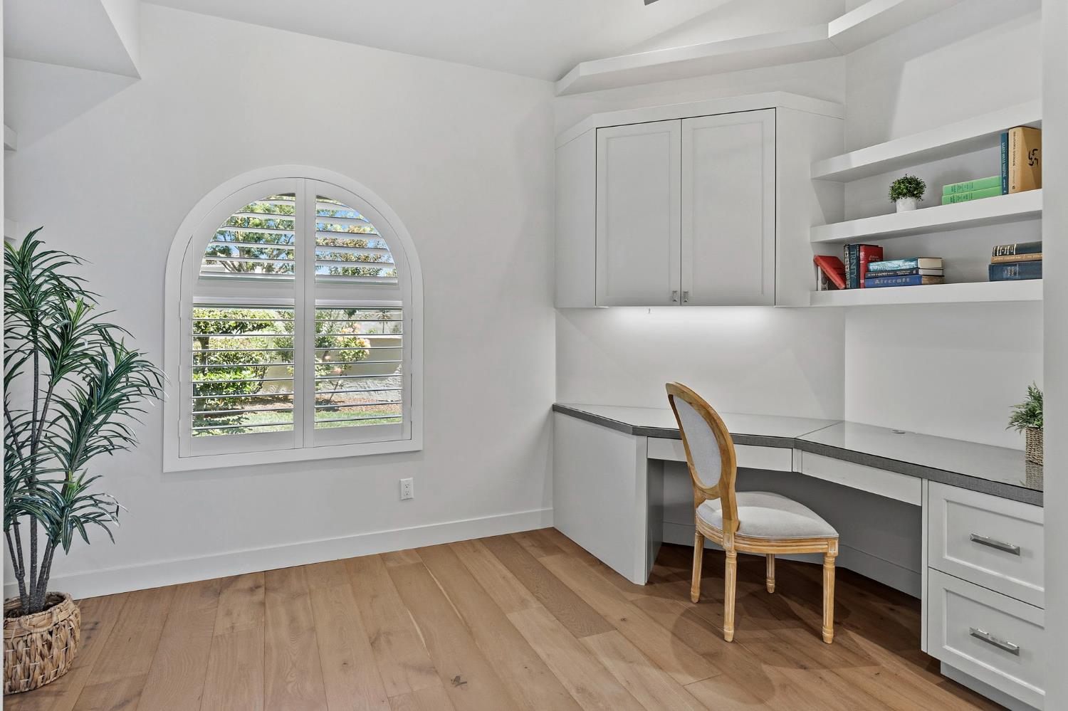 1013 Copper Lake Court Modesto, CA 95355 - Photo 26 of 66 a view of workspace with a window and wooden floor
