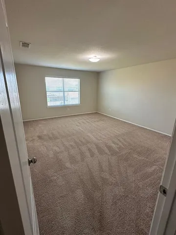 a bathroom with a toilet and a bathtub