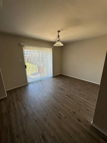a view of a livingroom with wooden floor