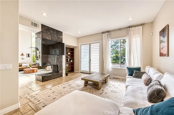 a living room with furniture and a large window