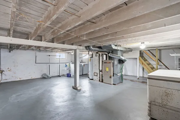 a view of empty room with wooden ceiling