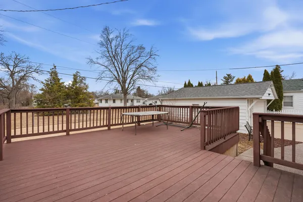 a view of a house with pool and wooden floor