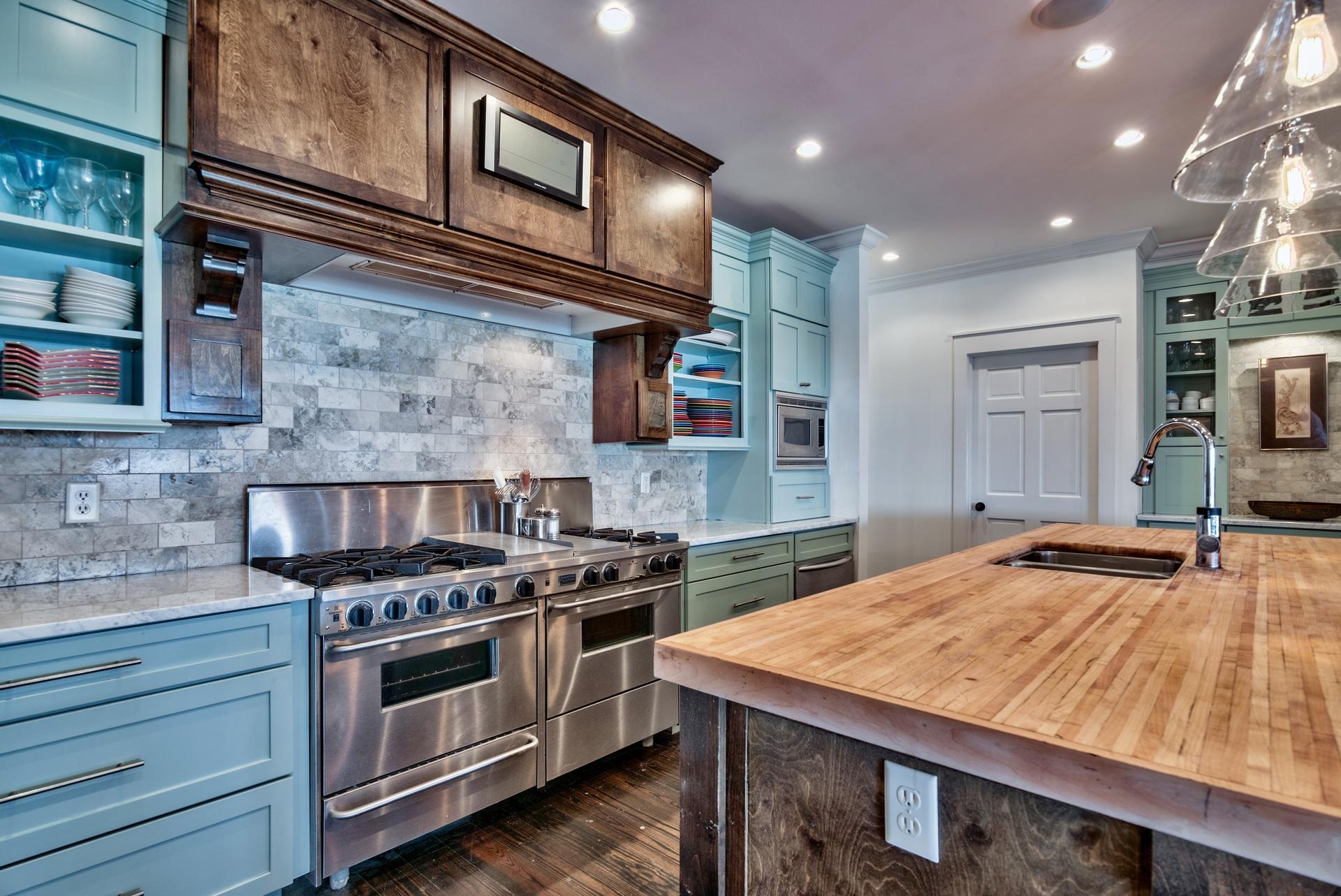 59 Auburn Drive Santa Rosa Beach, FL 32459 - Photo 25 of 71 a kitchen with stainless steel appliances granite countertop a stove and a wooden cabinets