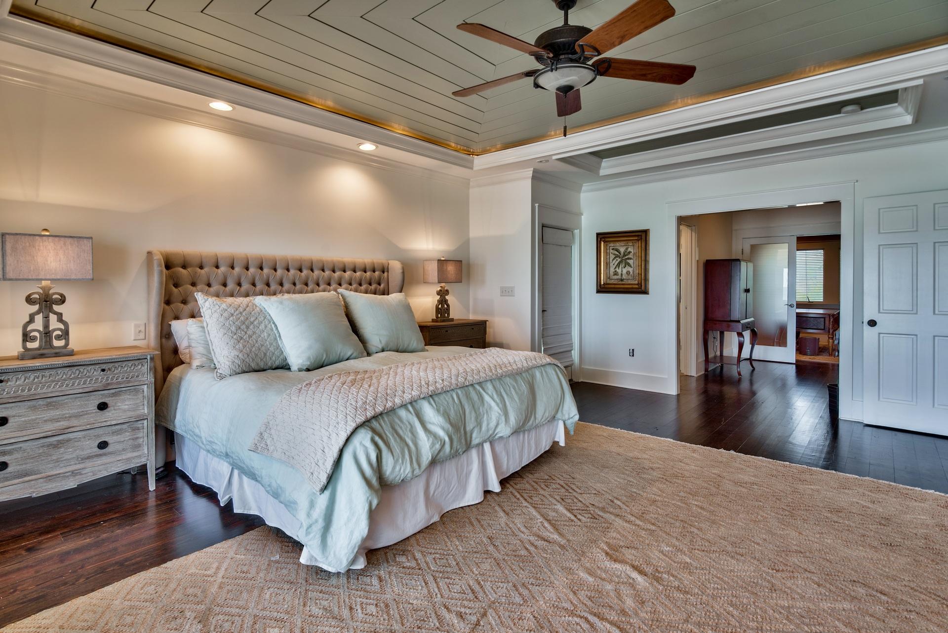 59 Auburn Drive Santa Rosa Beach, FL 32459 - Photo 31 of 71 a spacious bedroom with a bed and a chandelier