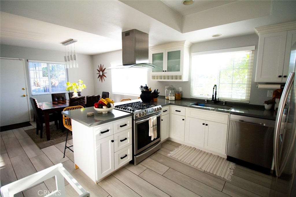 808 Gian Drive Torrance, CA 90502 - Photo 12 of 36 a kitchen with a sink stove and cabinets