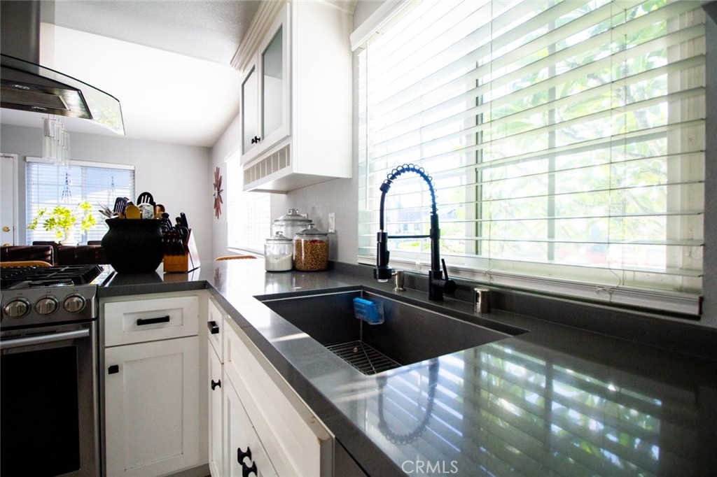 808 Gian Drive Torrance, CA 90502 - Photo 14 of 36 a kitchen with a sink cabinets and stainless steel appliances