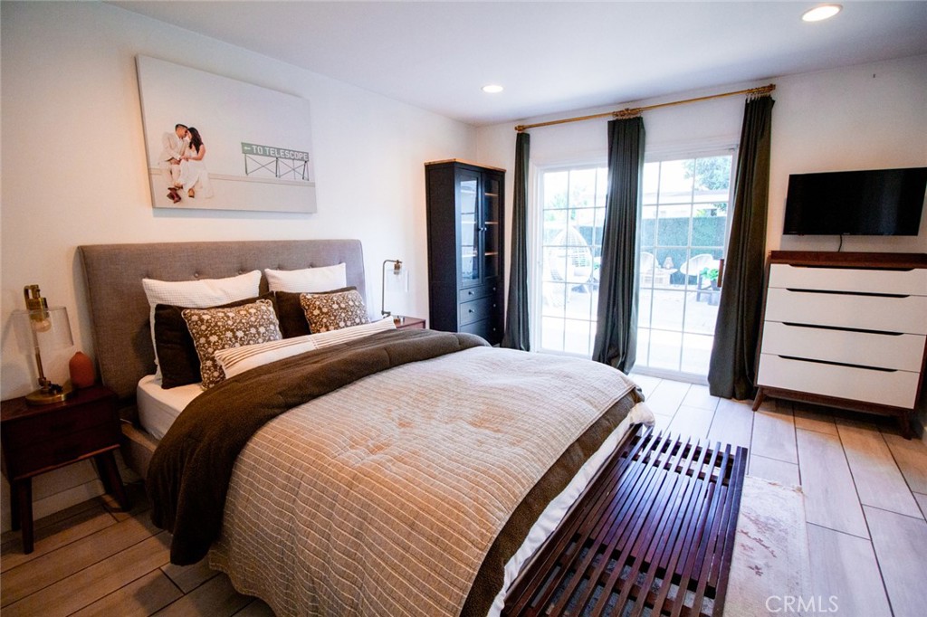 808 Gian Drive Torrance, CA 90502 - Photo 22 of 36 a bedroom with a large bed and a flat tv screen