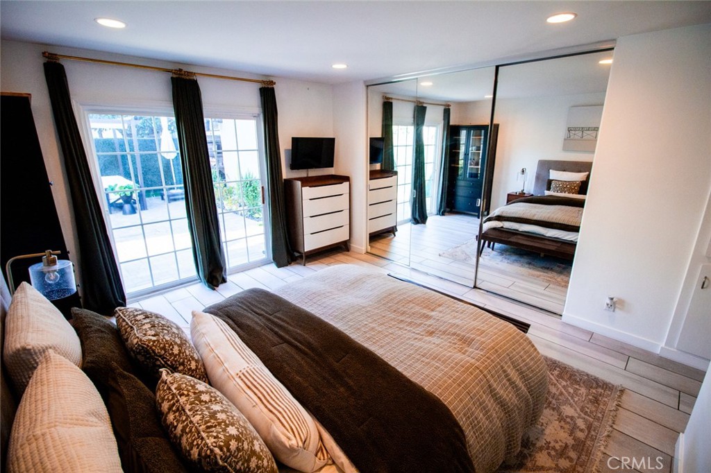 808 Gian Drive Torrance, CA 90502 - Photo 23 of 36 a bedroom with a bed and glass door