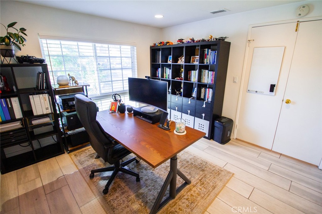 808 Gian Drive Torrance, CA 90502 - Photo 26 of 36 a view of a workspace with furniture and a bookshelf