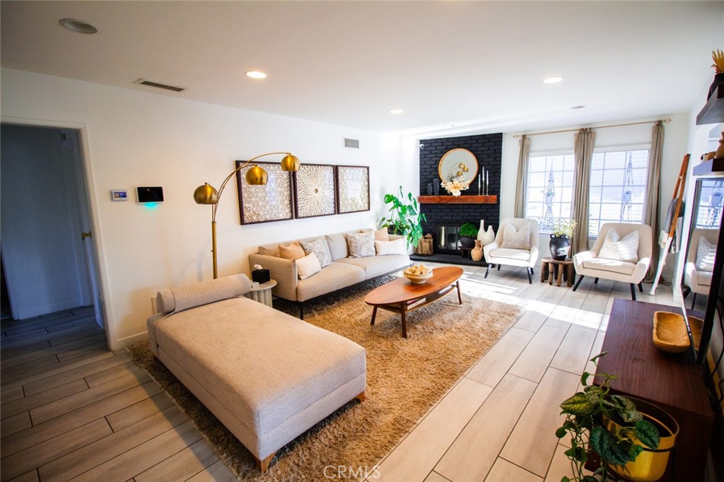 808 Gian Drive Torrance, CA 90502 - Photo 9 of 36 a living room with furniture and a fireplace