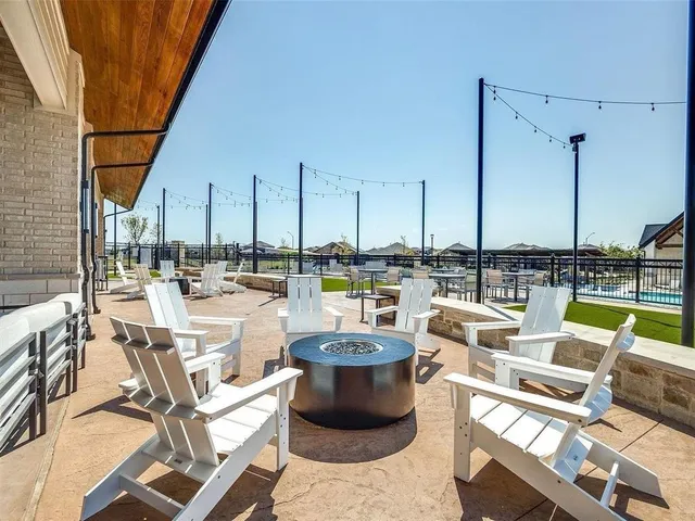 an aerial view of a house with a yard basket ball court and outdoor seating