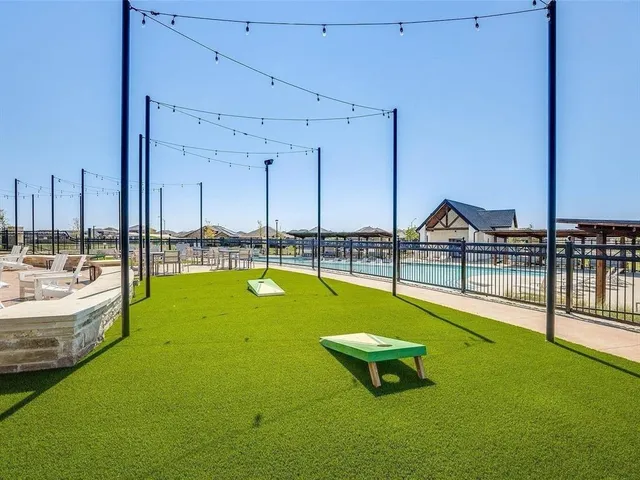 a view of a patio with couches chairs and a potted plant