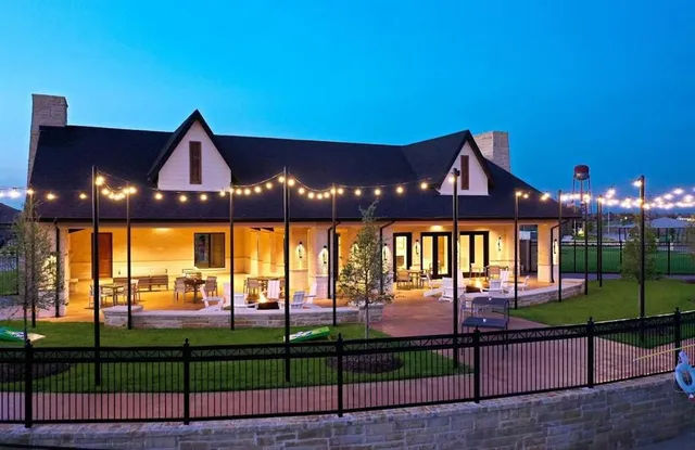 a swimming pool with outdoor seating and yard