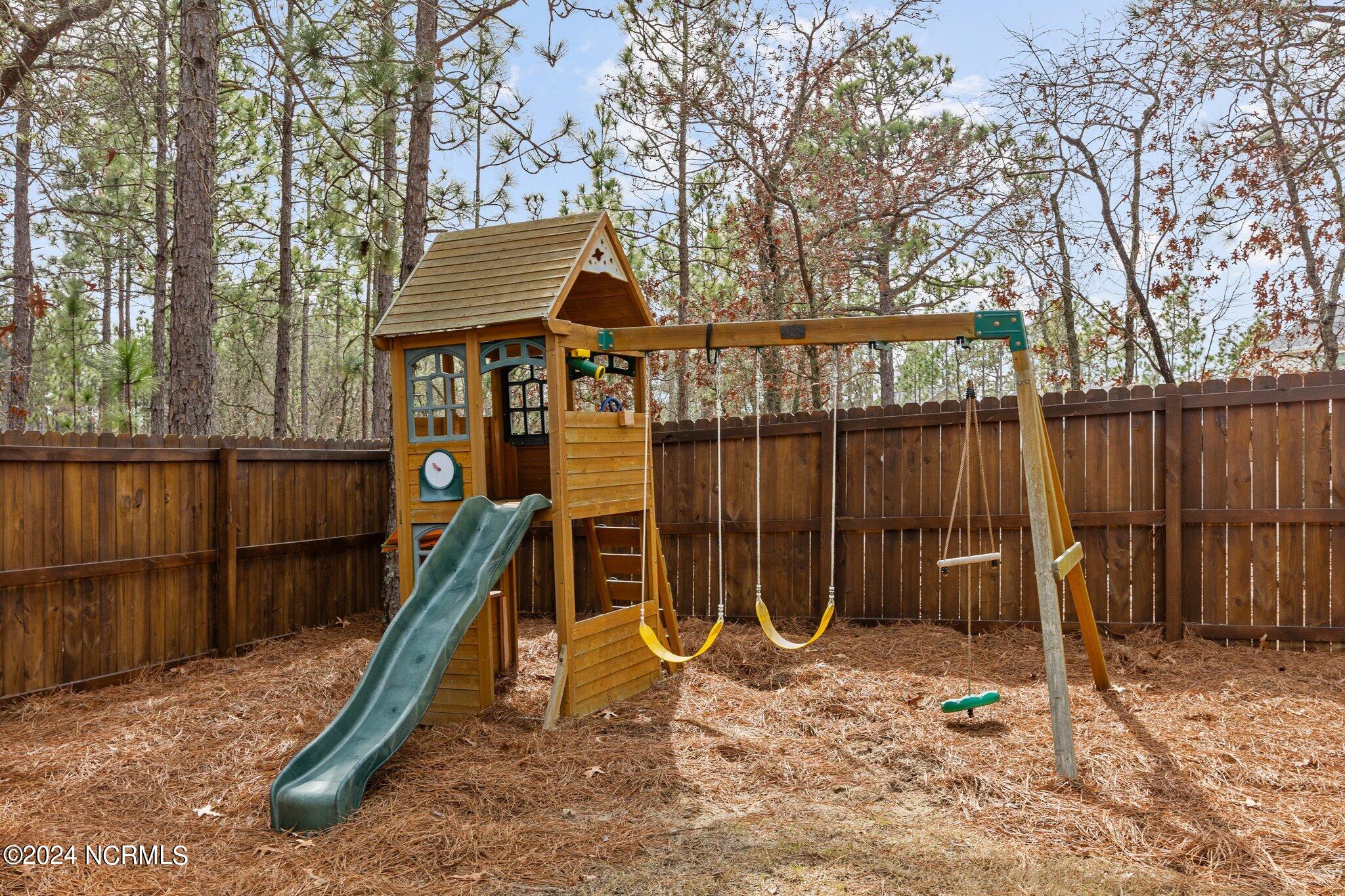 4055 Irwin Drive Aberdeen, NC 28315 - Photo 28 of 32 Fully Fenced Back Yard with Play Area (playset conveys)