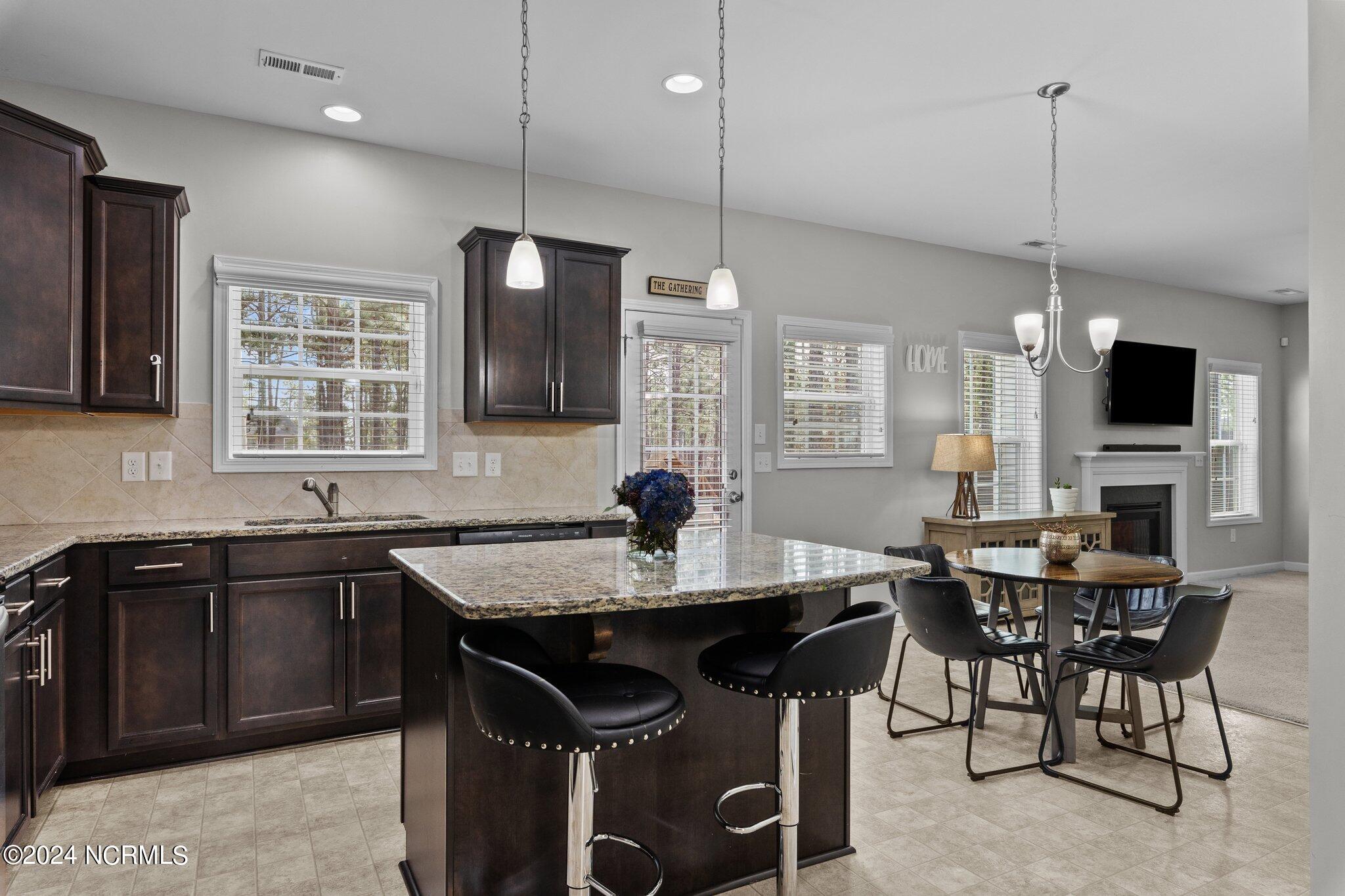 4055 Irwin Drive Aberdeen, NC 28315 - Photo 8 of 32 Kitchen with Island and Eat-In Area