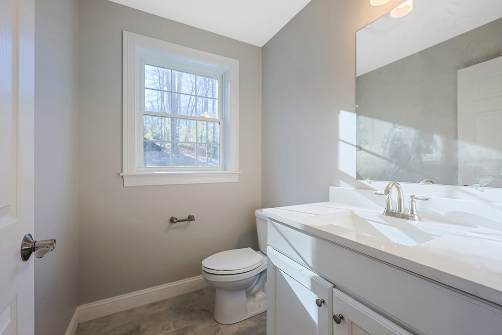 19 Oriole Drive Groton, MA 01450 - Photo 14 of 33 a bathroom with a sink toilet and vanity
