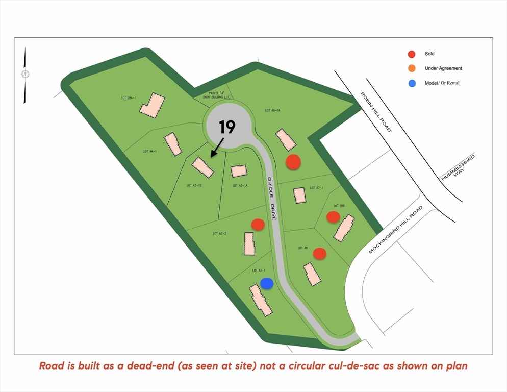 19 Oriole Drive Groton, MA 01450 - Photo 3 of 33 a green field with plants and a bench