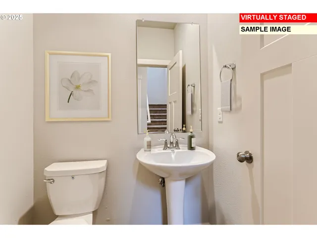 a bathroom with a sink a toilet and mirror