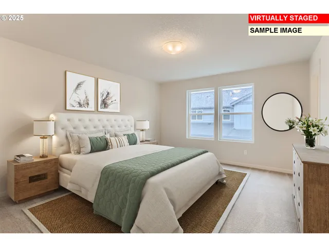 a bedroom with a bed mirror on wall and a window