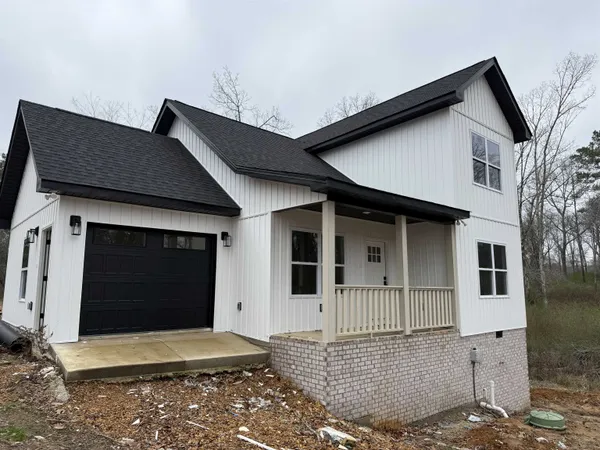 a front view of a house with a garage