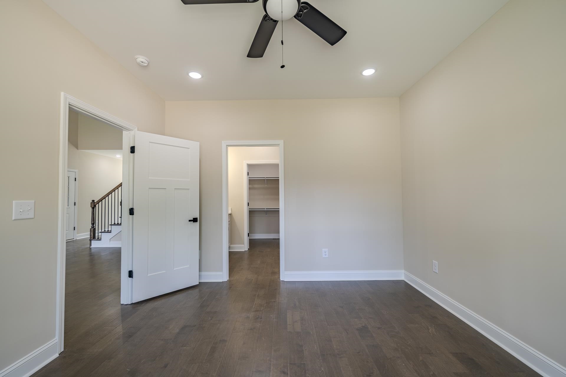 50 Fox Trot Road Adamsville, TN 38310 - Photo 14 of 40 a view of a livingroom with wooden floor and ceiling fan
