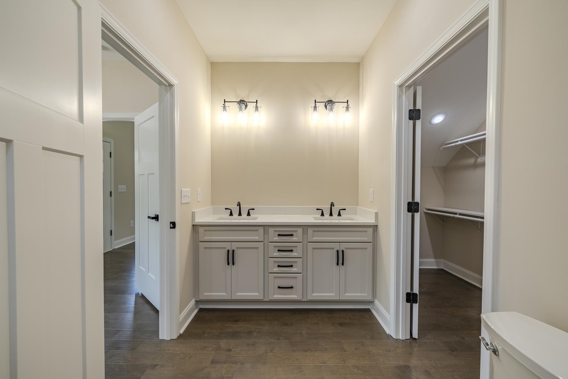 50 Fox Trot Road Adamsville, TN 38310 - Photo 15 of 40 a bathroom with a double vanity sink and mirror
