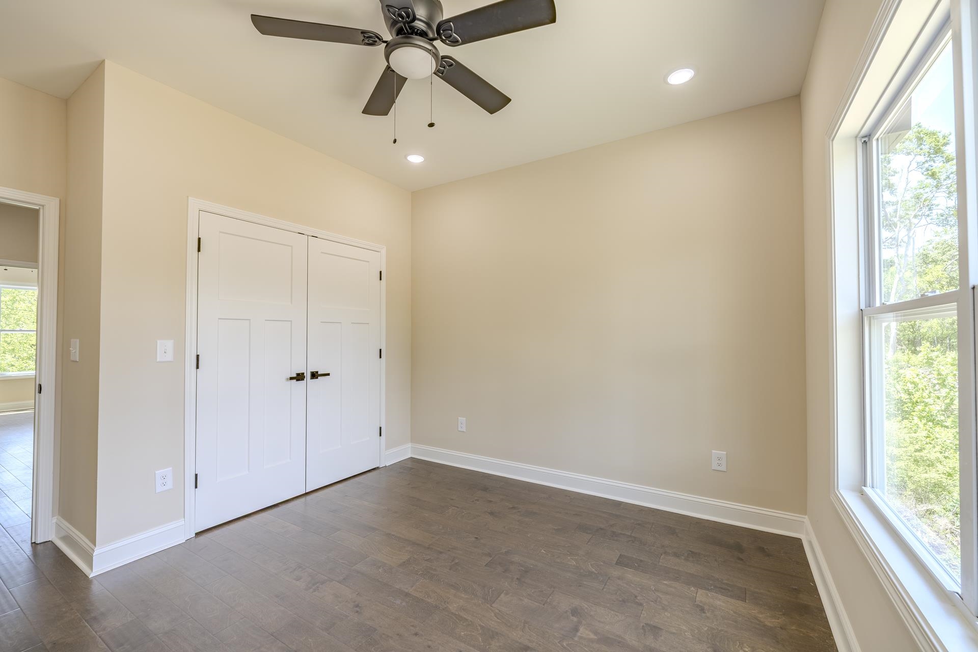 50 Fox Trot Road Adamsville, TN 38310 - Photo 22 of 40 an empty room with windows and fan