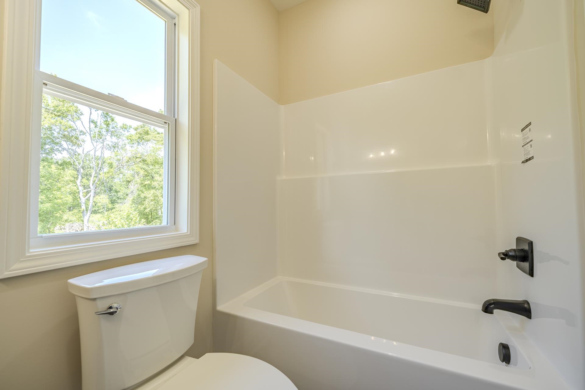 50 Fox Trot Road Adamsville, TN 38310 - Photo 24 of 40 a bathroom with a bathtub and a shower