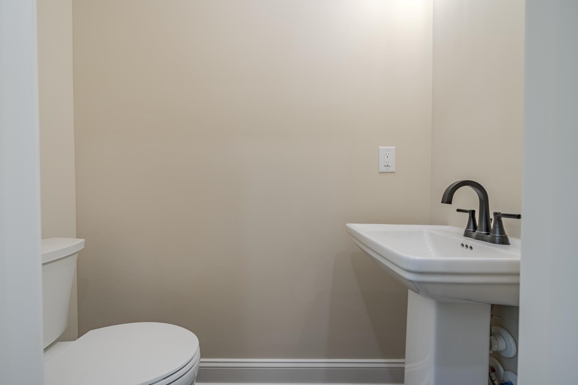 50 Fox Trot Road Adamsville, TN 38310 - Photo 29 of 40 a bathroom with a sink a toilet