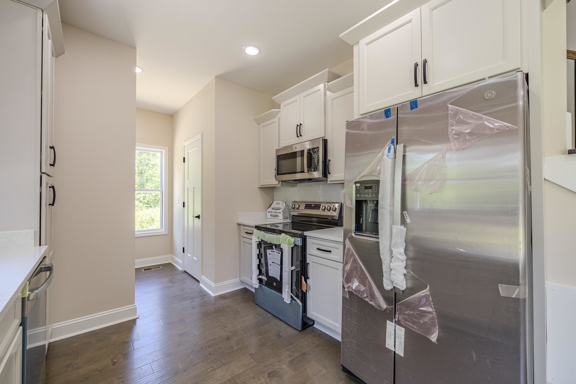 50 Fox Trot Road Adamsville, TN 38310 - Photo 3 of 40 a kitchen with stainless steel appliances a refrigerator and a stove top oven