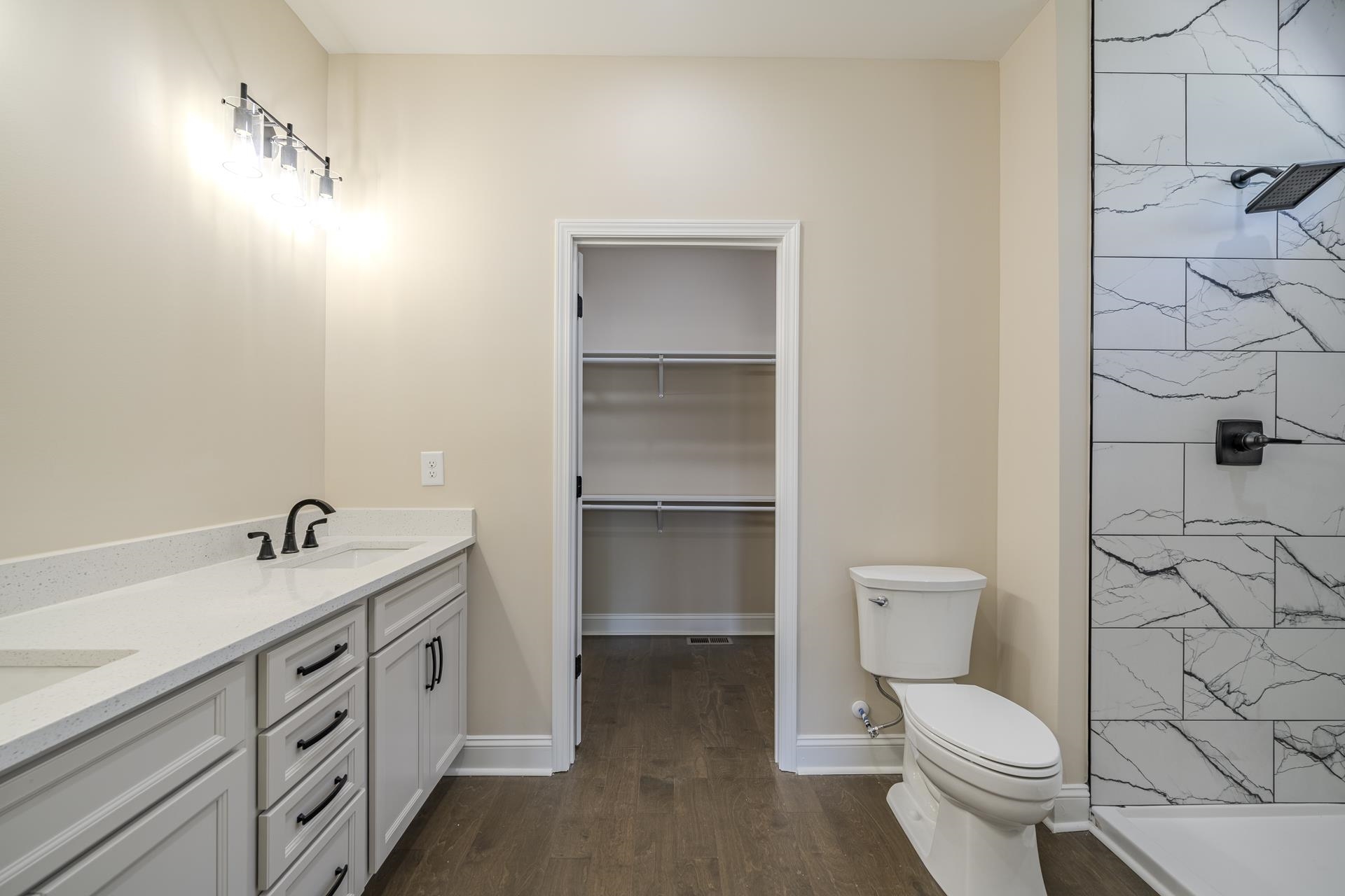 50 Fox Trot Road Adamsville, TN 38310 - Photo 32 of 40 a bathroom with a toilet sink and shower