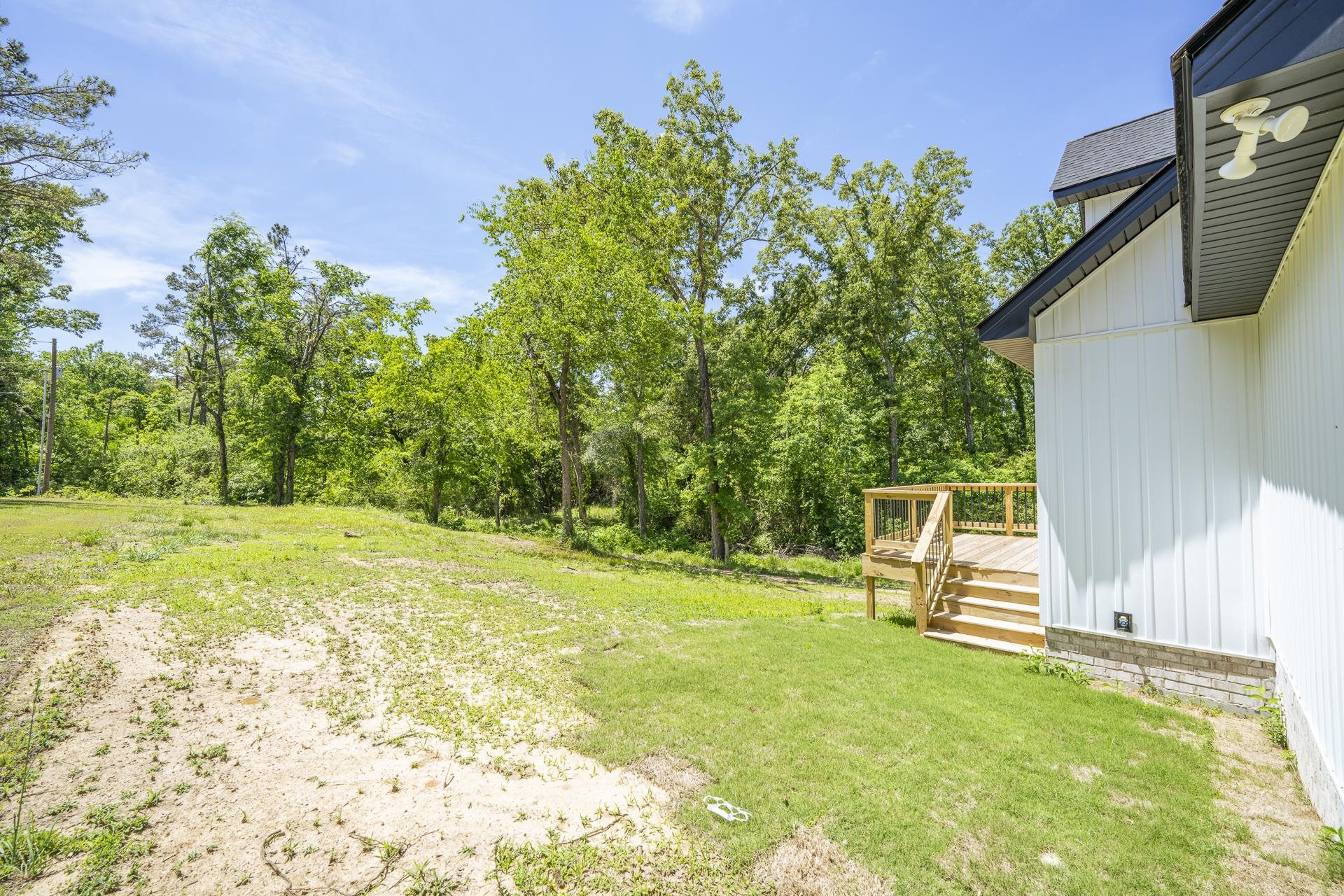 50 Fox Trot Road Adamsville, TN 38310 - Photo 35 of 40 a view of a backyard with wooden fence