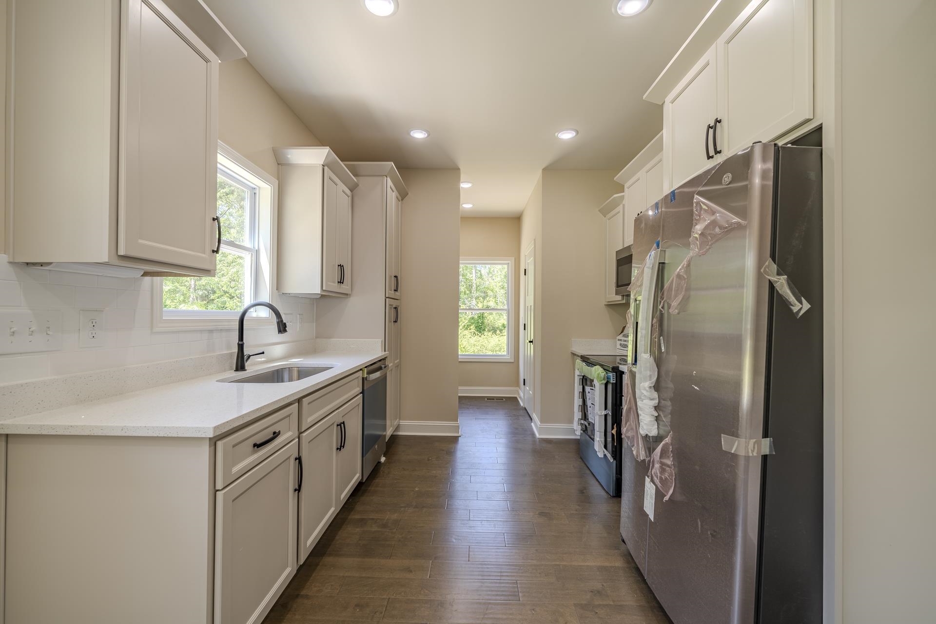 50 Fox Trot Road Adamsville, TN 38310 - Photo 4 of 40 a kitchen with stainless steel appliances a sink stove and refrigerator
