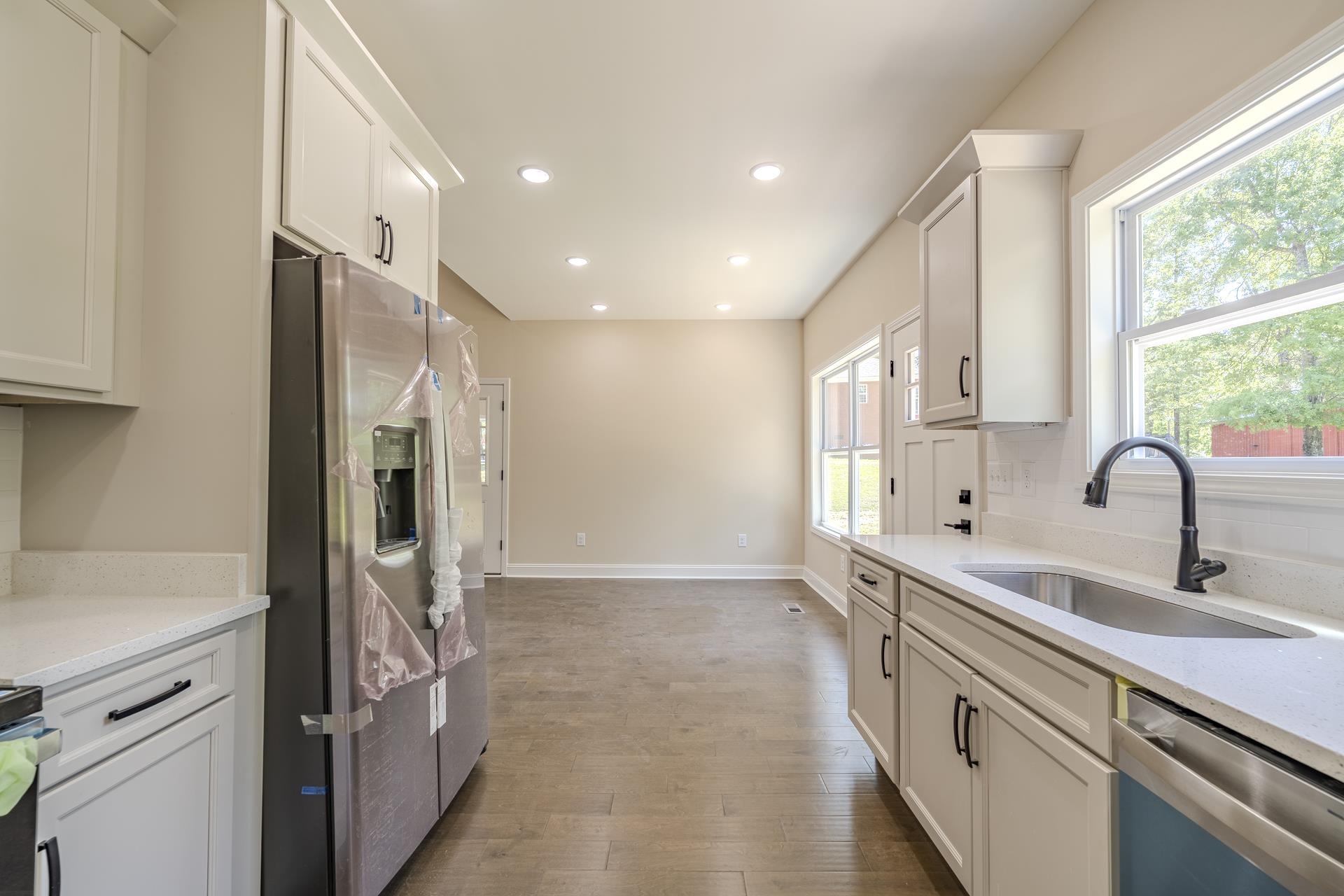 50 Fox Trot Road Adamsville, TN 38310 - Photo 5 of 40 a kitchen with stainless steel appliances granite countertop a refrigerator and a sink