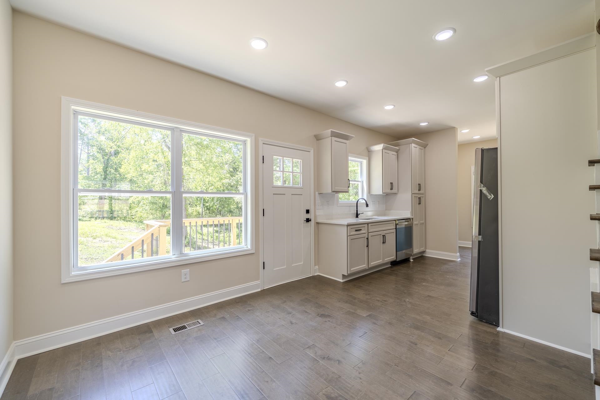 50 Fox Trot Road Adamsville, TN 38310 - Photo 6 of 40 a view of a big room with windows and cabinet