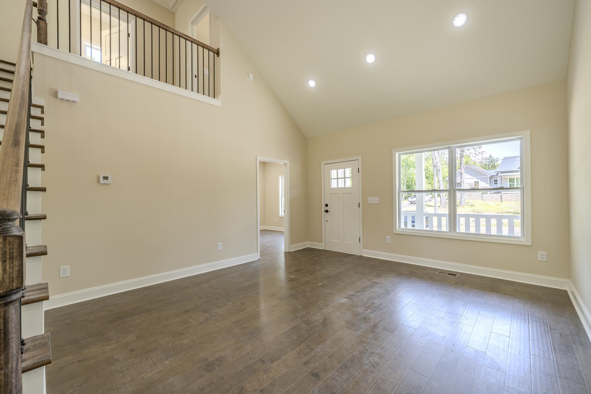 50 Fox Trot Road Adamsville, TN 38310 - Photo 10 of 40 an empty room with wooden floor and windows