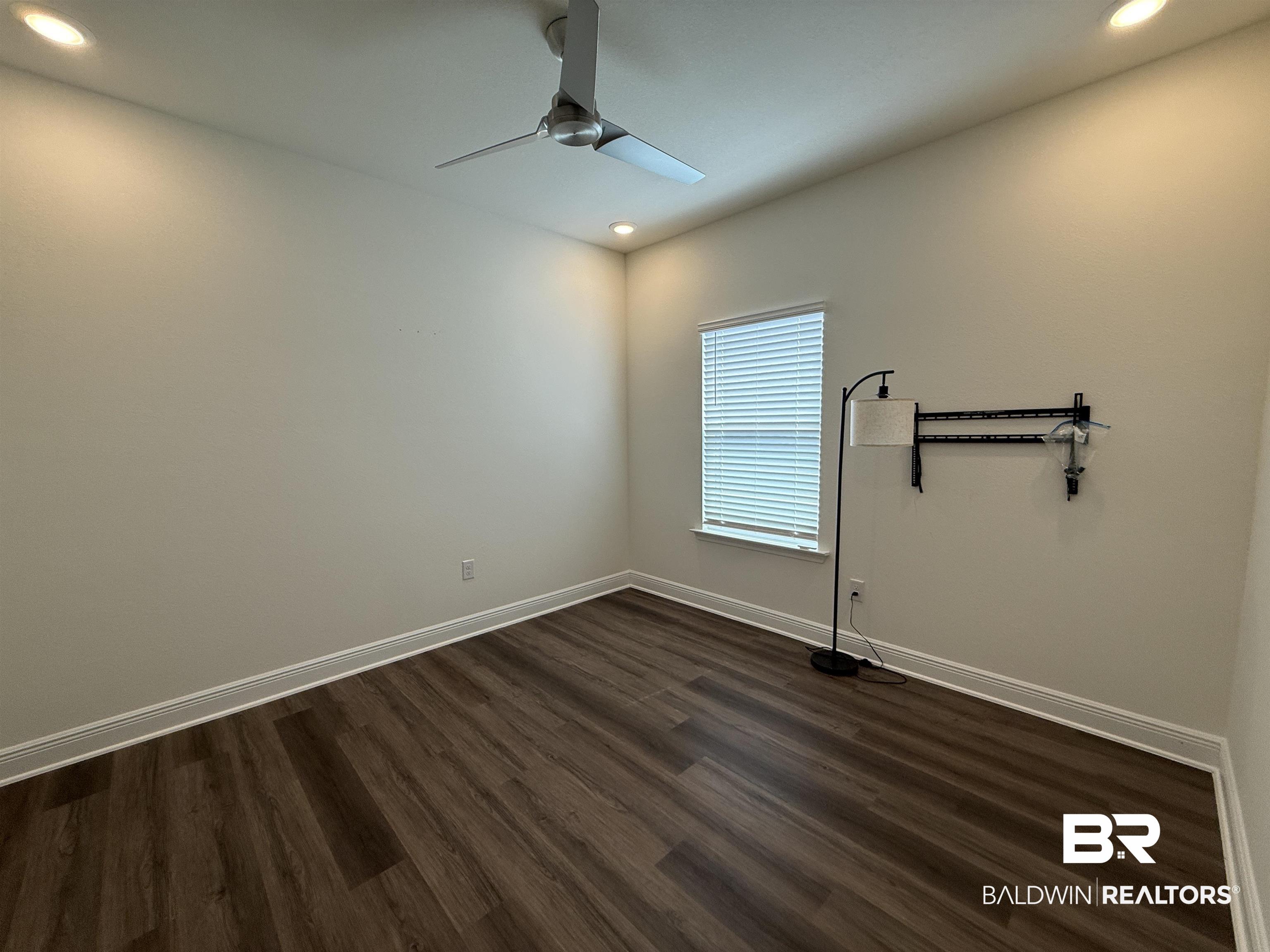 11442 Genuine Risk Circle Daphne, AL 36526 - Photo 17 of 21 Spare room featuring dark wood-style floors, a ceiling fan, and recessed lighting