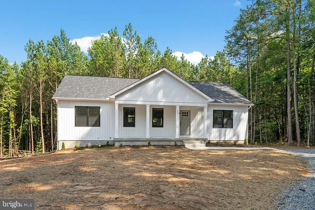 a front view of a house with yard