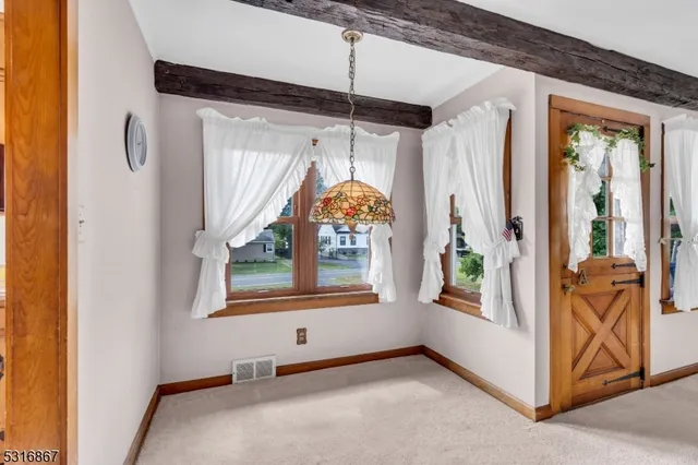 a bathroom with a sink vanity granite and toilet