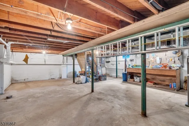 a view of a house with a big yard and sitting area