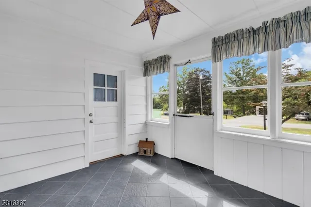 a view of room with window and cabinet