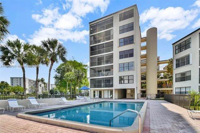 a view of a building with a swimming pool