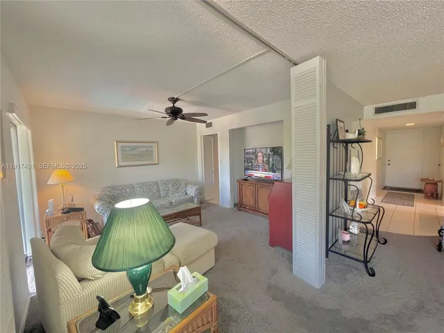 a living room with furniture and a table