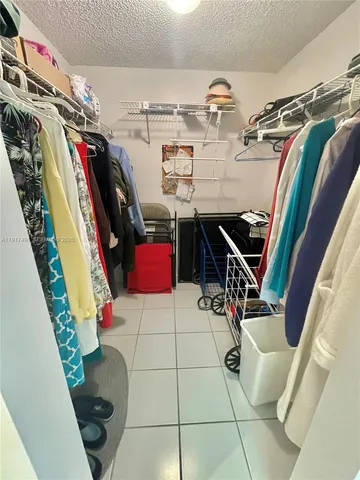 a view of a backyard with plants and patio