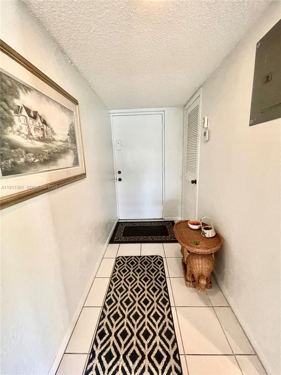 2309 South Cypress Bend Drive, Unit 311 Pompano Beach, FL 33069 - Photo 4 of 51 a bathroom with a toilet and a shower