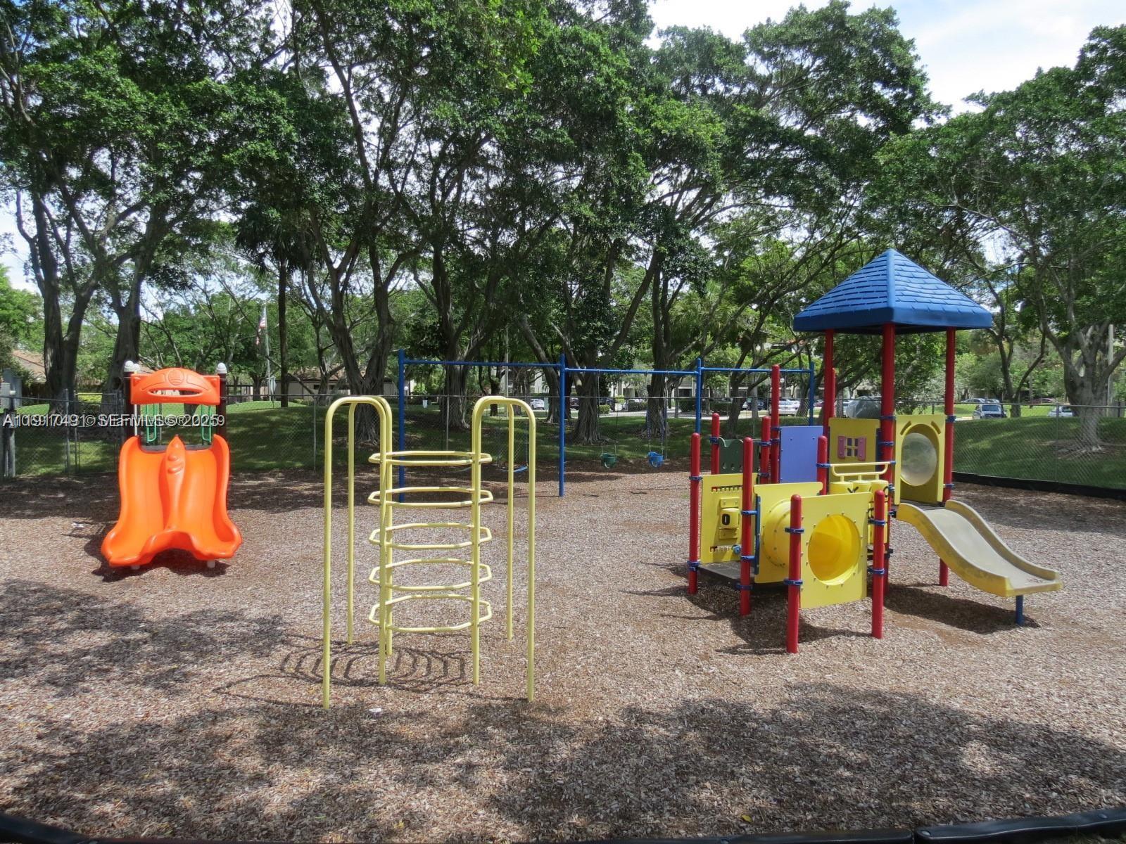2309 South Cypress Bend Drive, Unit 311 Pompano Beach, FL 33069 - Photo 44 of 51 a view of a park with slide