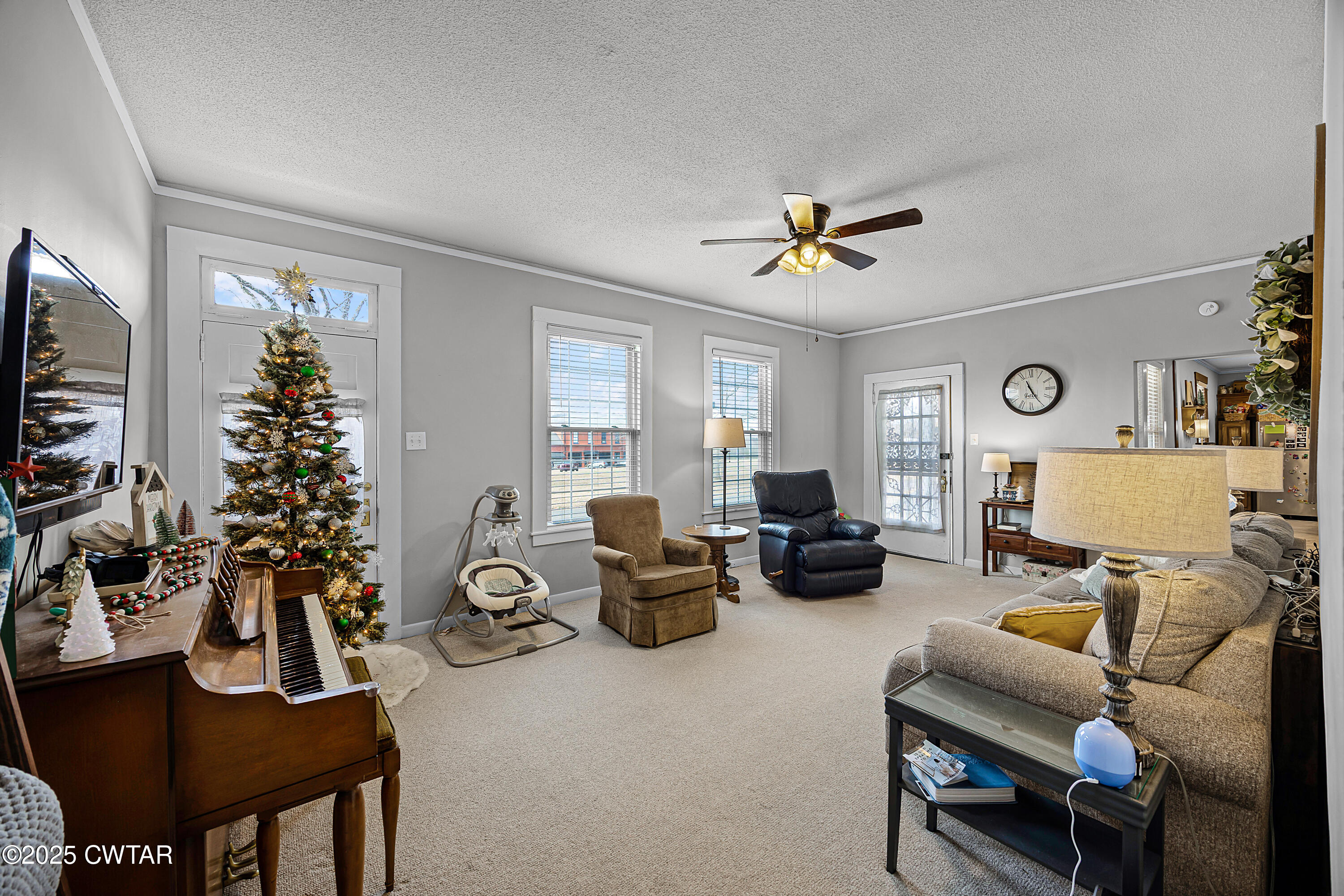 7 Herron Street Jackson, TN 38301 - Photo 11 of 19 a living room with furniture and a flat screen tv