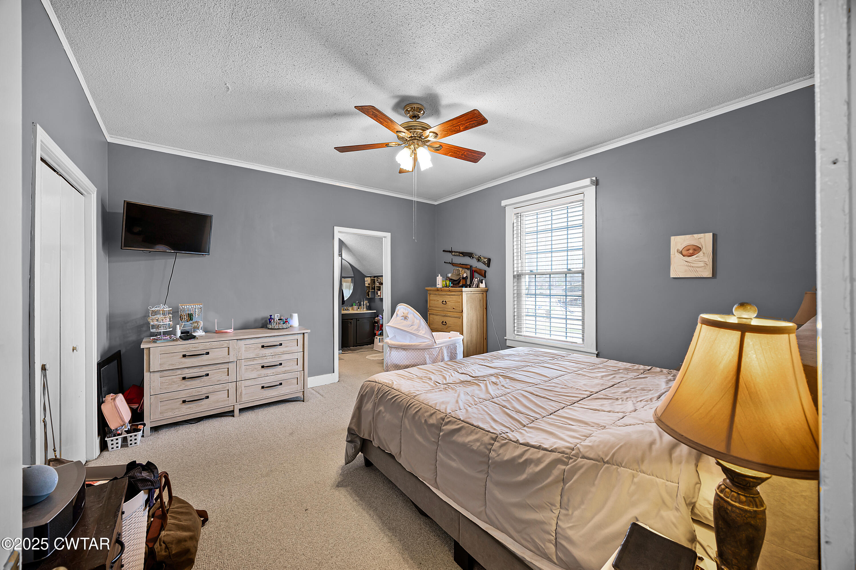 7 Herron Street Jackson, TN 38301 - Photo 13 of 19 a bedroom with a bed and furniture