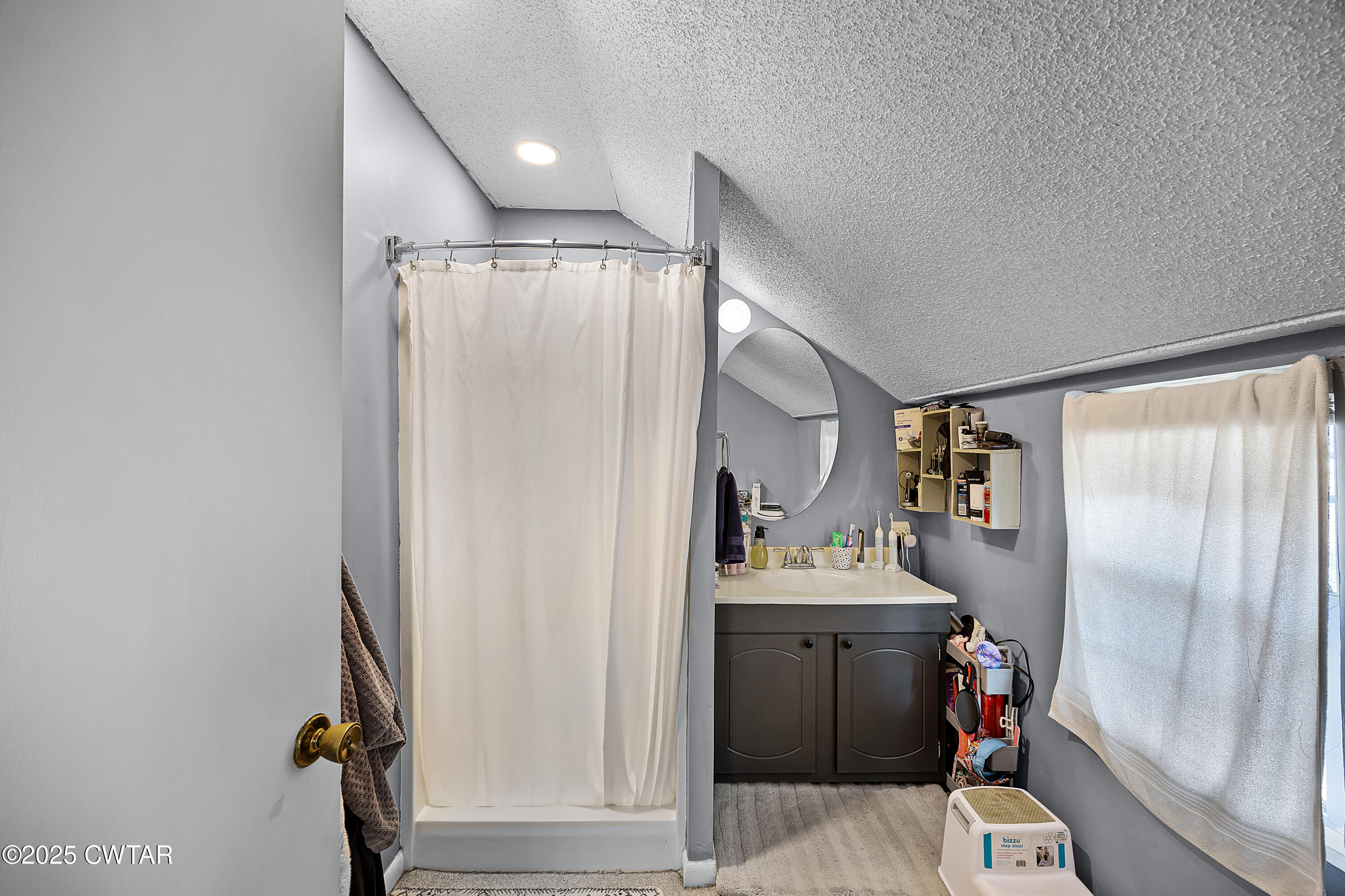7 Herron Street Jackson, TN 38301 - Photo 14 of 19 a bathroom with a sink and a mirror
