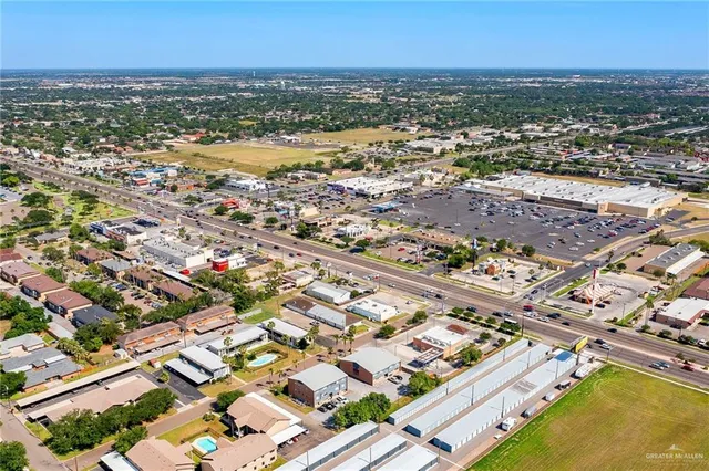 an aerial view of residential building and lake
